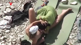 Beach Voyeur. Unashamed nudists having sex out of reach of the beach right near others